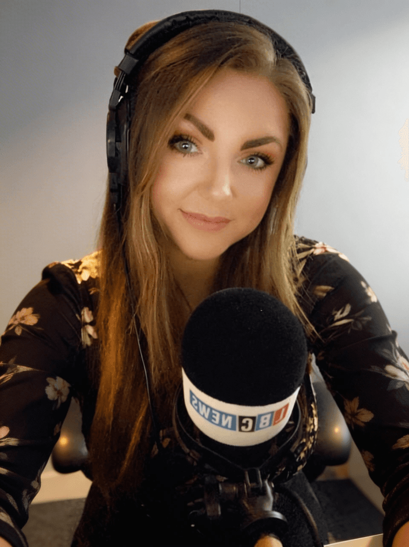 Rachel Gerrish at the LBC News broadcast desk with headphones and microphone